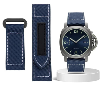 Navy watch strap with a watch on a white background