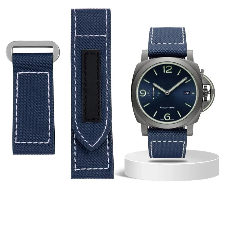 Watch with blue strap and additional strap on a white background
