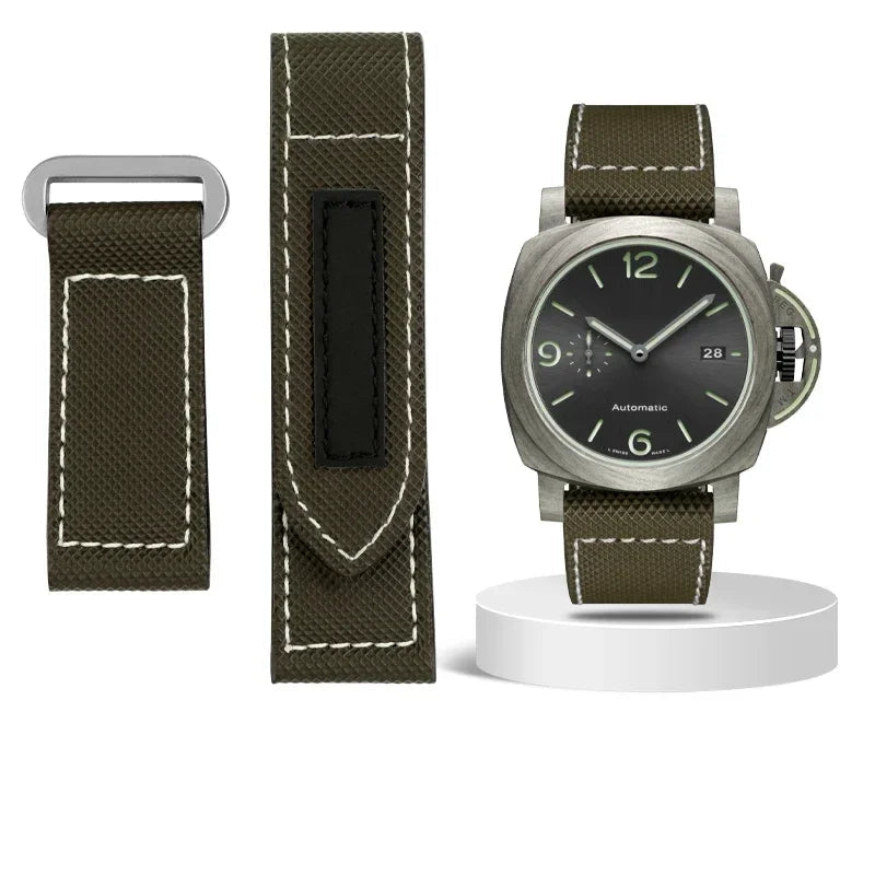 Watch with green strap and black dial on a white background