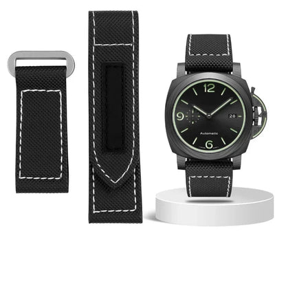 Black watch with strap and tools on a white background