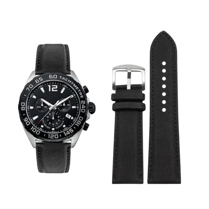 Black watch with detailed face and black strap on a white background