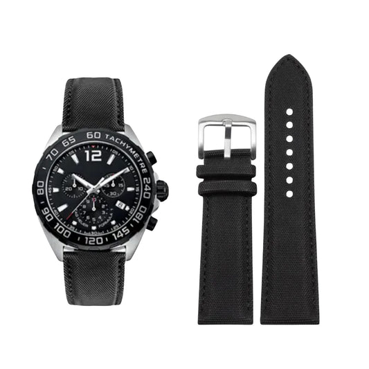 Black watch with detailed face and black strap on a white background