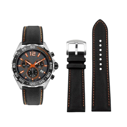 Black watch with orange accents and a matching black strap on a white background