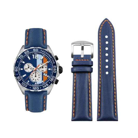 Blue watch with matching strap on a white background